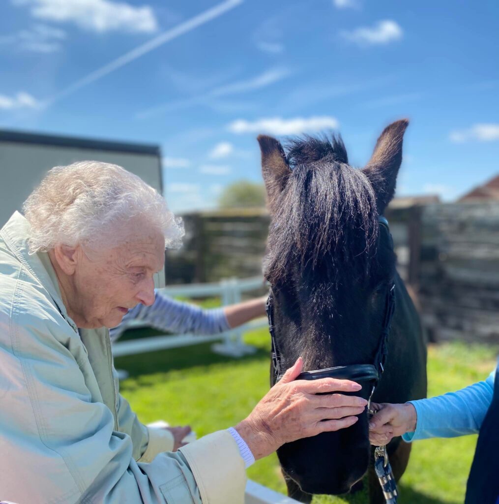 elderly lady with horse